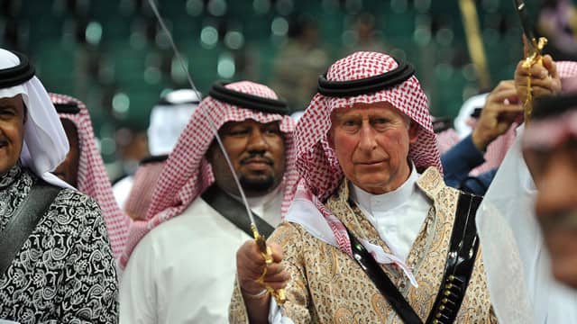 Prince Charles - In Arab Garb with a Sword Drawn.